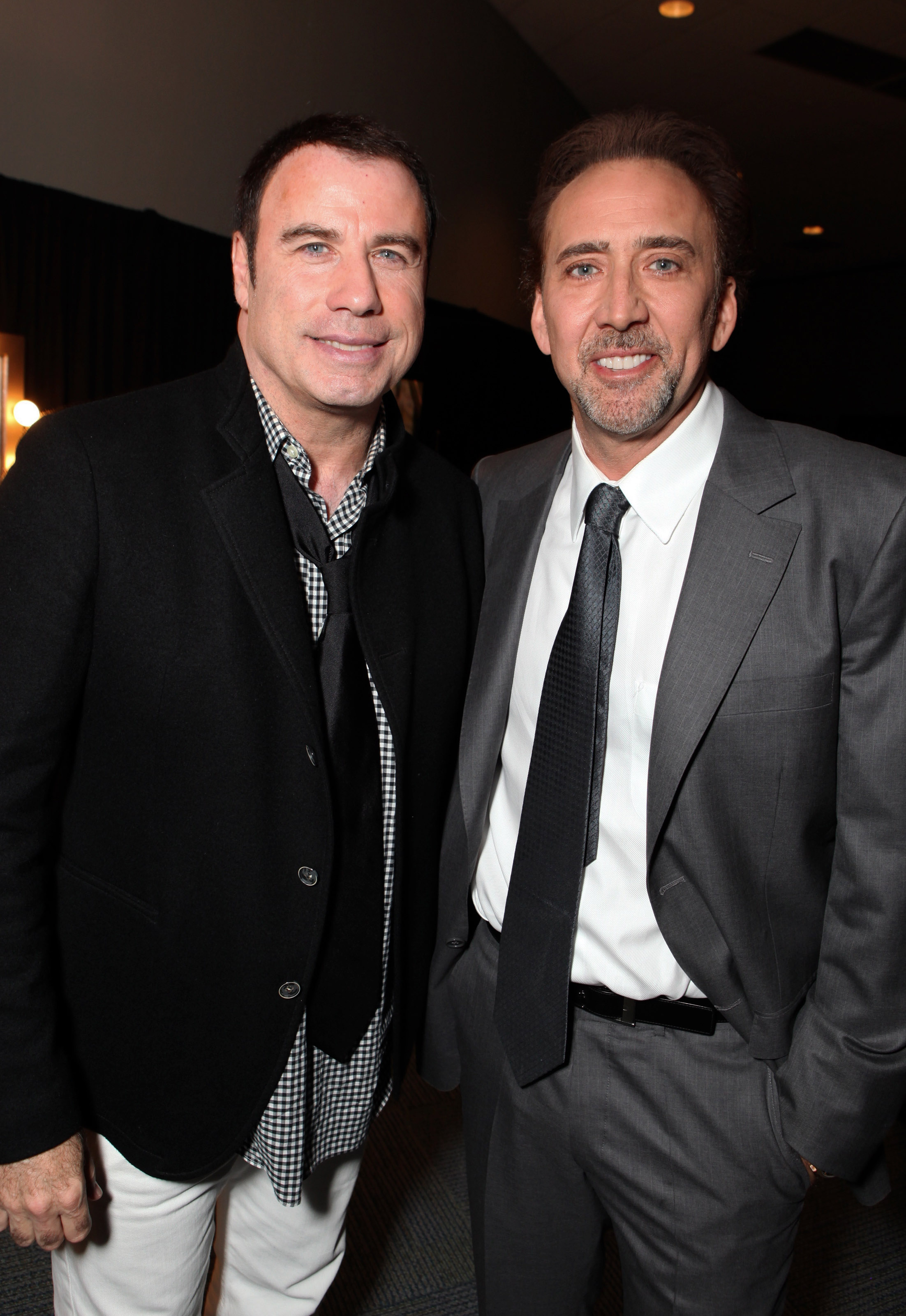 John Travolta makes a return to public life alongside Nicolas Cage at Disney’s D23 Expo in Anaheim, Calif., on September 11, 2009