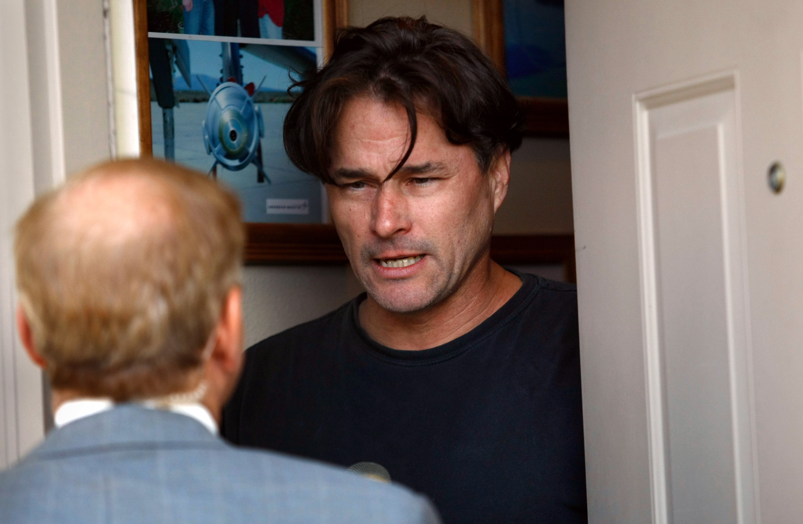 Richard Heene speaks to a reporter from the front door of his home October 15, 2009 in Ft. Collins, Colorado