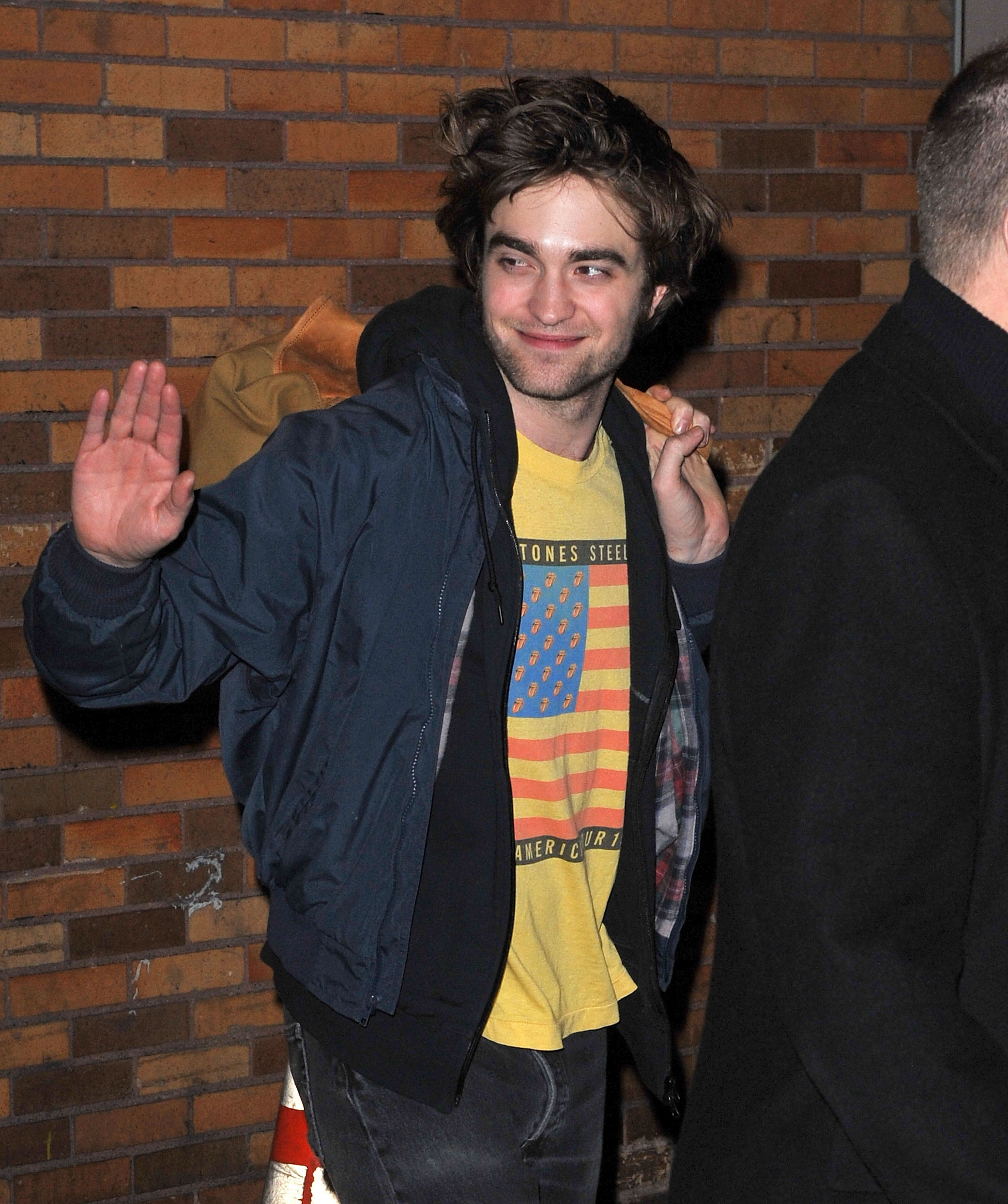 Robert Pattinson waves to fans in New York City on March 2, 2010