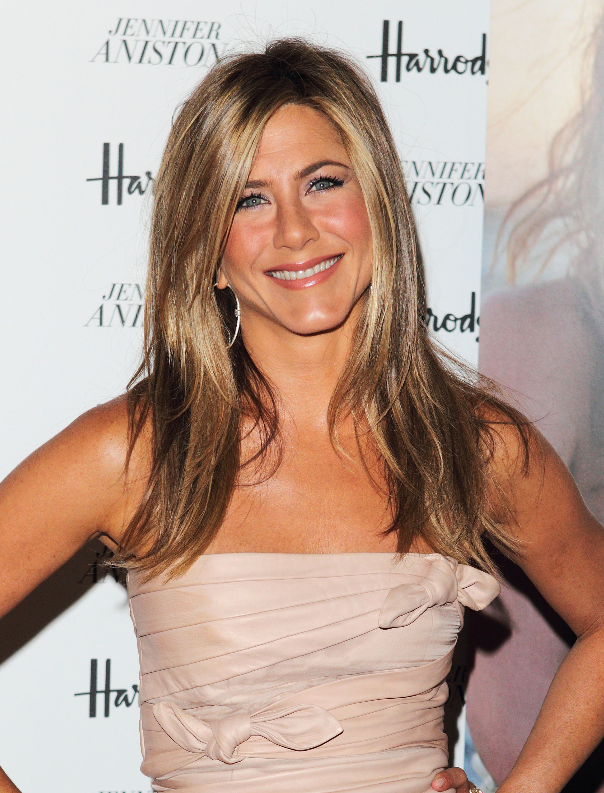 Jennifer Aniston attends photocall at launch of her new signature fragrance at Harrods on July 21, 2010 in London, England.