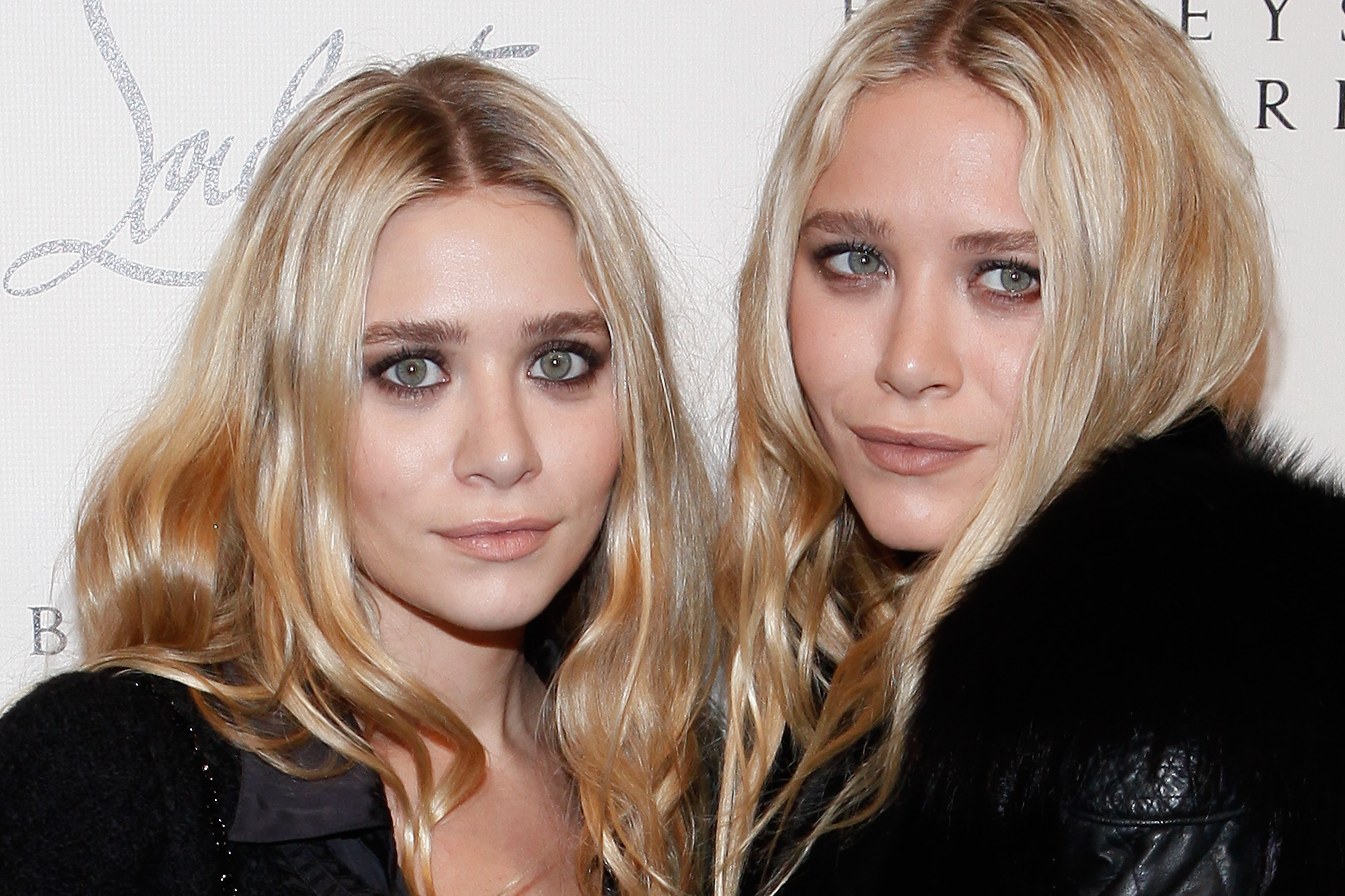 Ashley Olsen and Mary-Kate Olsen attend the Christian Louboutin Cocktail party at Barneys New York in New York City on November 1, 2011