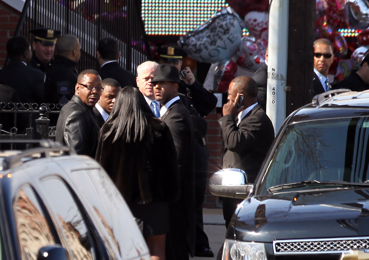 Bobby Brown and entourage exit Whitney Houston’s funeral in Newark, New Jersey, on February 18, 2012