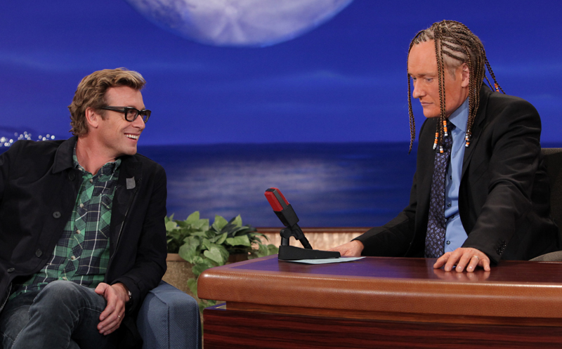 Guest Simon Baker of ‘The Mentalist’ marvels at Conan O’Brien’s cornrows and spray tan on ‘Conan,’ Oct. 25, 2012