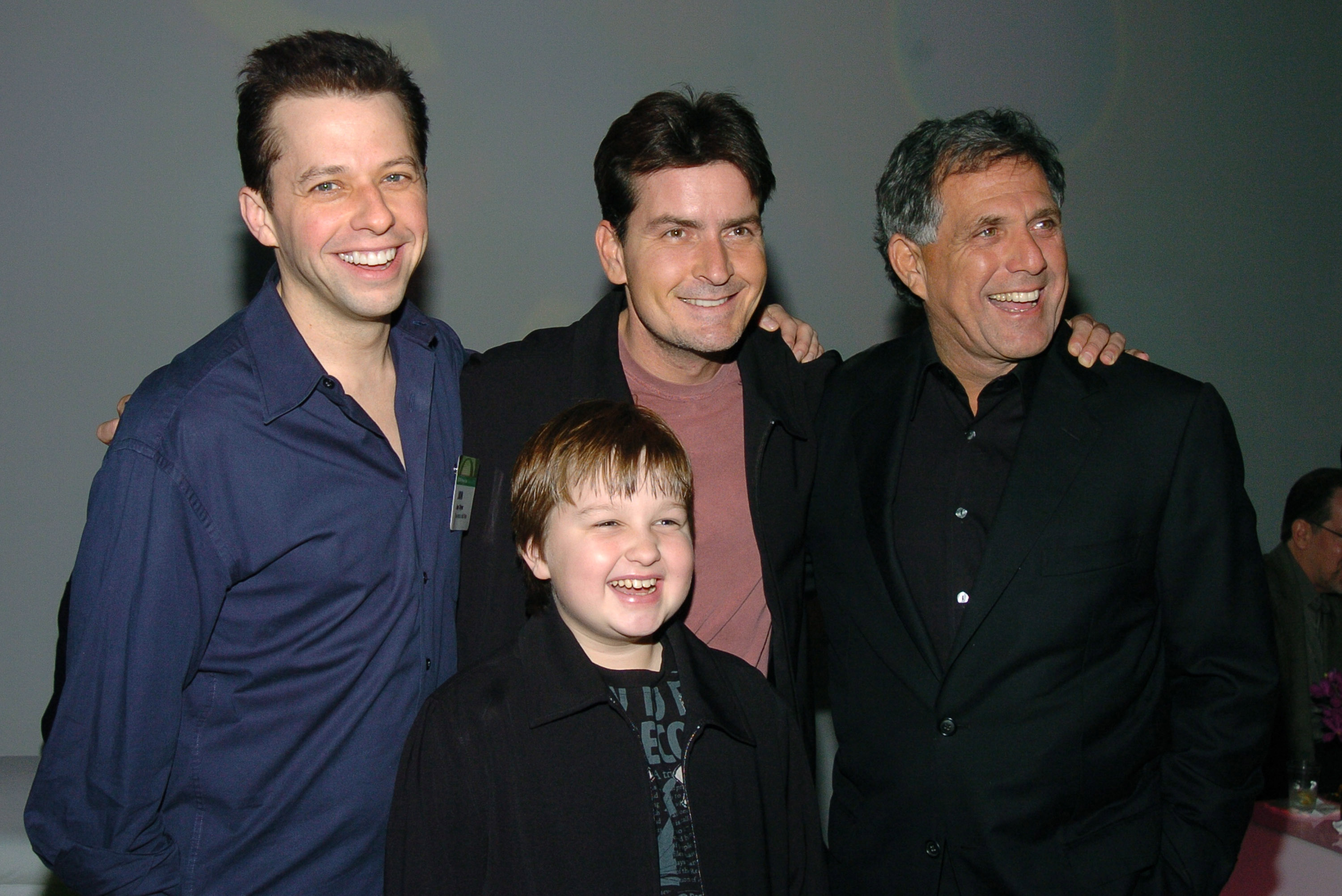 Jon Cryer, Charlie Sheen, Leslie Moonves, co-president and co-COO Viacom and chairman CBS, and Angus T. Jones, Jan. 18, 2005
