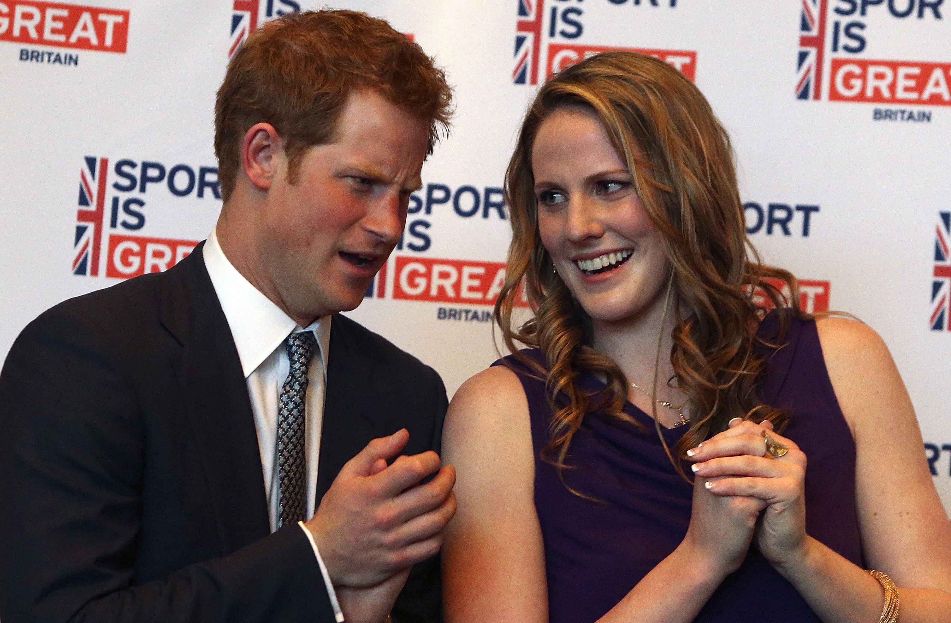 Prince Harry chats with Missy Franklin at a reception at the Sanctuary Golf Course on May 10, 2013 in Sedalia, Colorado