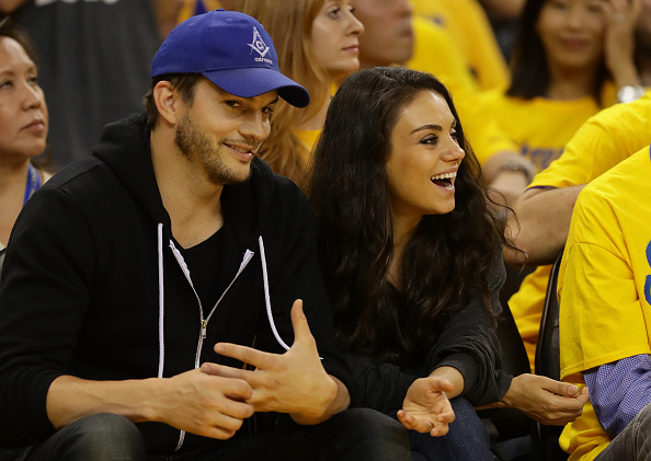 OAKLAND, CA - JUNE 05: (L-R) Actors Ashton Kutcher and Mila Kunis attend Game 2 of the 2016 NBA Finals between the Golden State Warriors and the Cleveland Cavaliers at ORACLE Arena on June 5, 2016 in Oakland, California. NOTE TO USER: User expressly acknowledges and agrees that, by downloading and or using this photograph, User is consenting to the terms and conditions of the Getty Images License Agreement. (Photo by Ezra Shaw/Getty Images) 2016 NBA Finals - Game Two