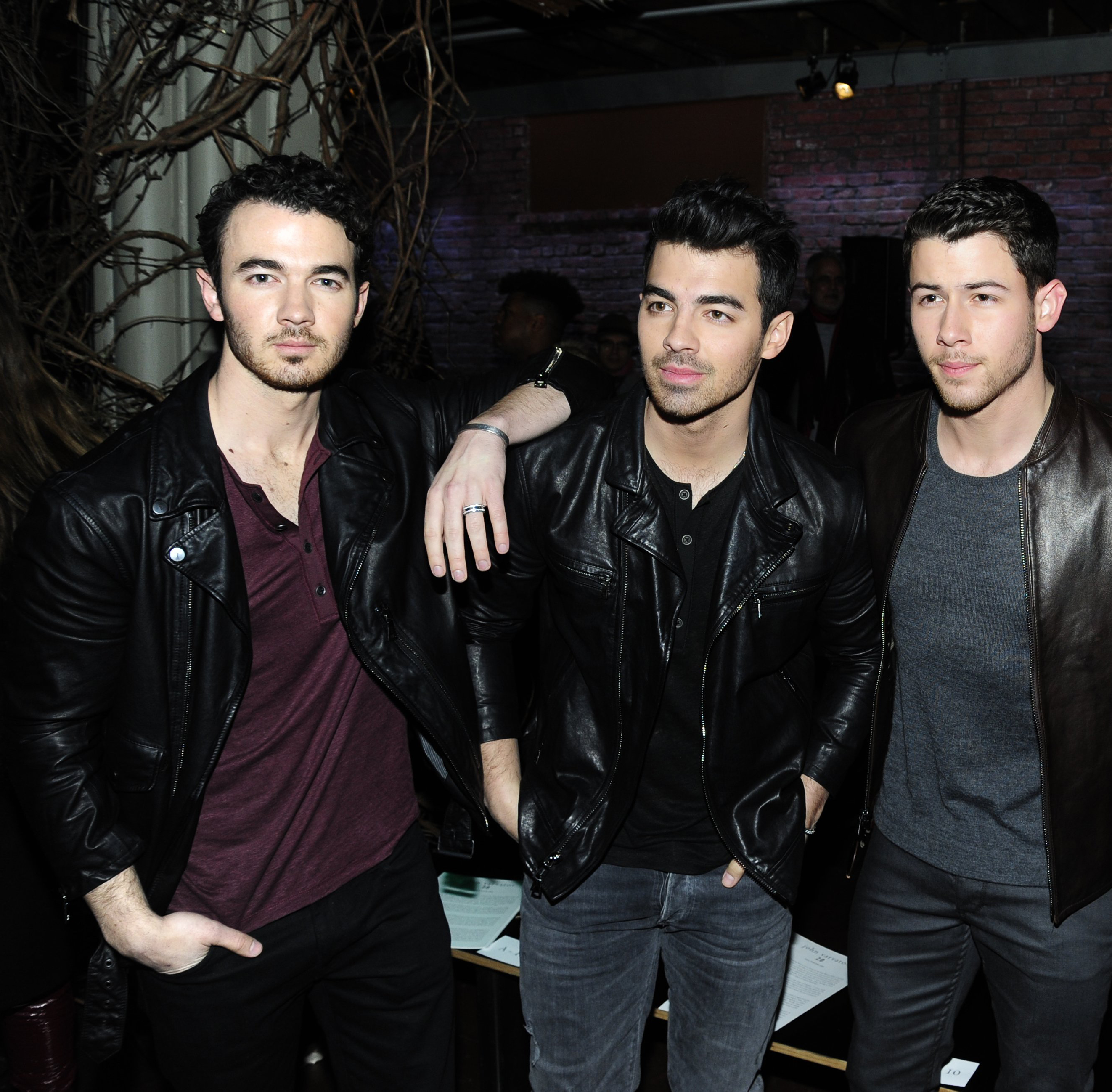 Kevin Jonas, Joe Jonas and Nick Jonas attend the John Varvatos Fall/Winter ...