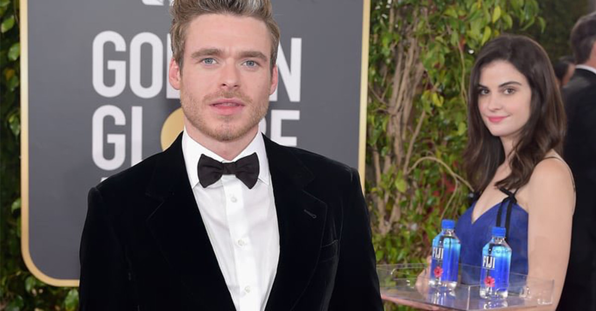 Richard Madden attends FIJI Water at the 76th Annual Golden Globe Awards on January 6, 2019 (Photo by Stefanie Keenan/Getty Images for FIJI Water) Fiji Water Girl standing behind Richard Madden