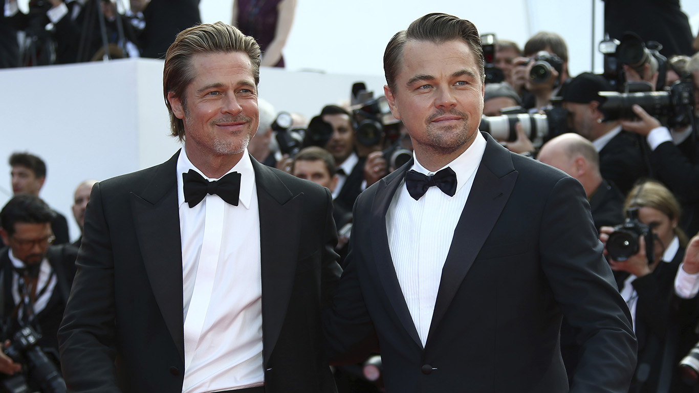 Actors Leonardo DiCaprio and Brad Pitt pose for photographers