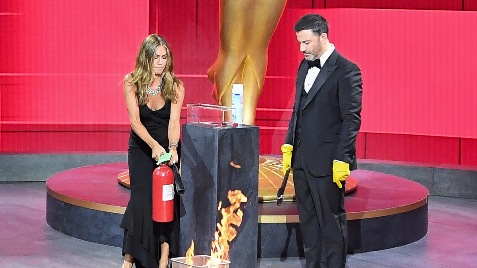 Jennifer Aniston & Jimmy Kimmel Set Fire To 2020 Emmys Envelope Onstage