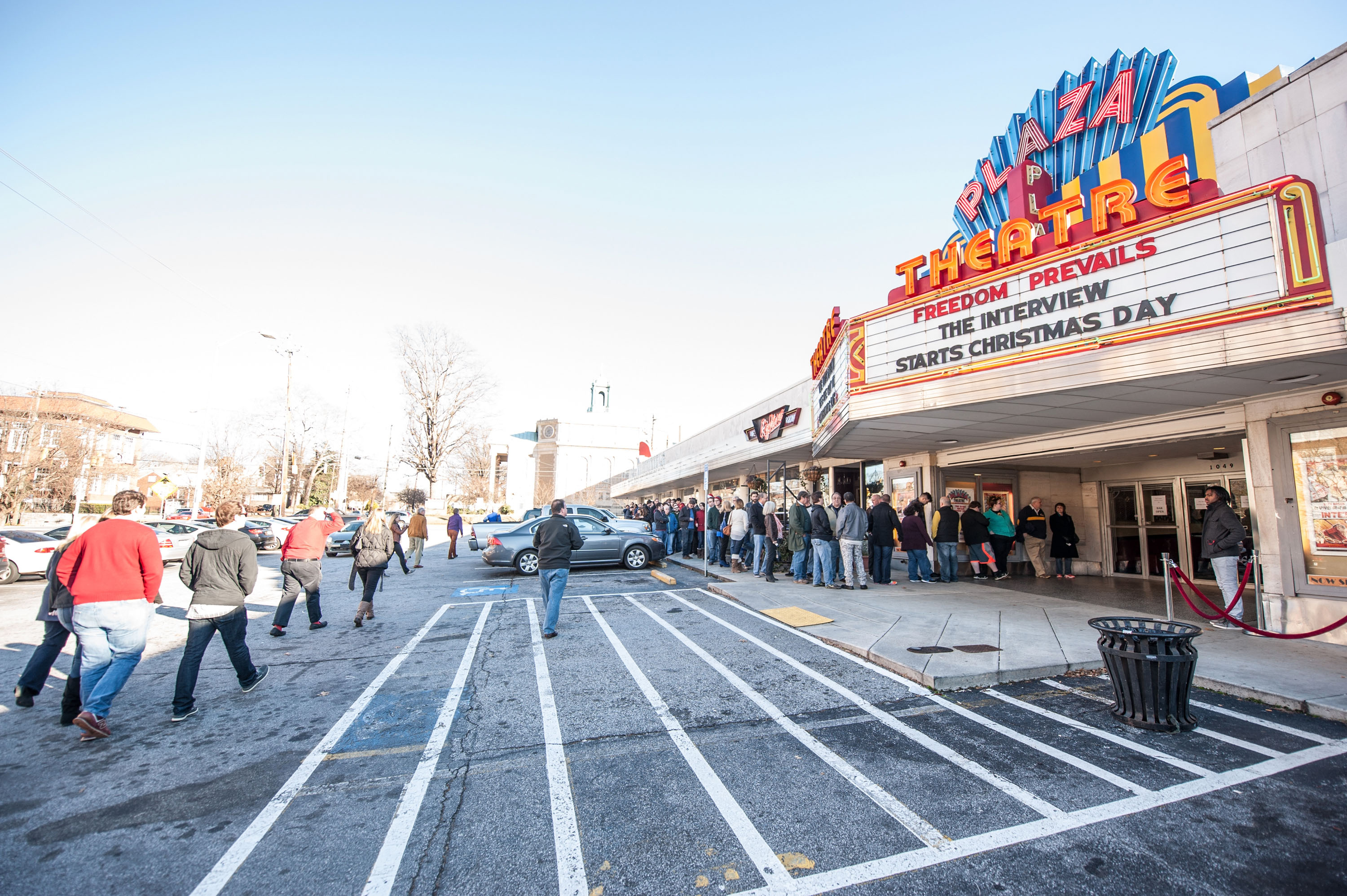 Movie goers wait in line for the 4:00 pm showing of Sony Pictures’ ‘The Interview’ at the Plaza Theatre on, Christmas Day, December 25, 2014 in Atlanta, Georgia