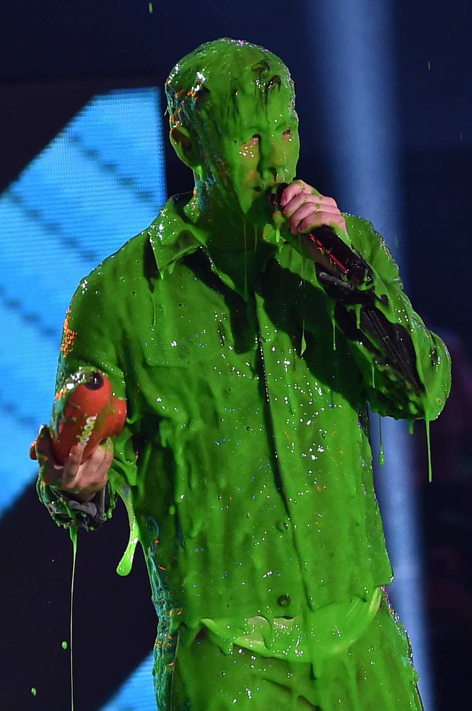 Nick Jonas get slimed while accepting award for Favorite Male Singer onstage during Nickelodeon’s 28th Annual Kids’ Choice Awards held at The Forum on March 28, 2015 in Inglewood, Calif.