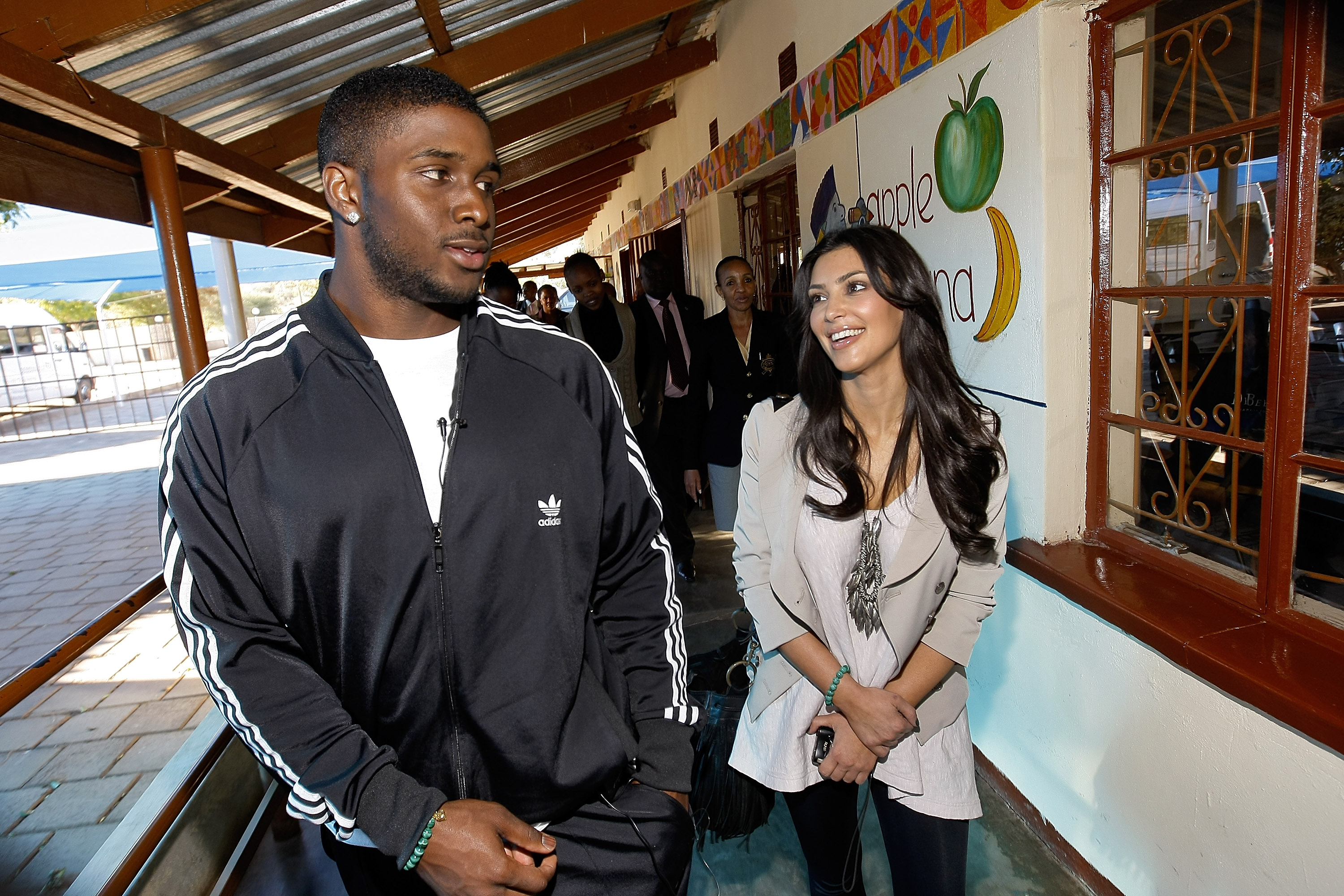 Kim Kardashian and boyfriend Reggie Bush pay a visit to the Motswedi Rehabilitation Centre during a Diamond Empowerment Fund tour of Africa in Mochudi, Botswana on July 14, 2009