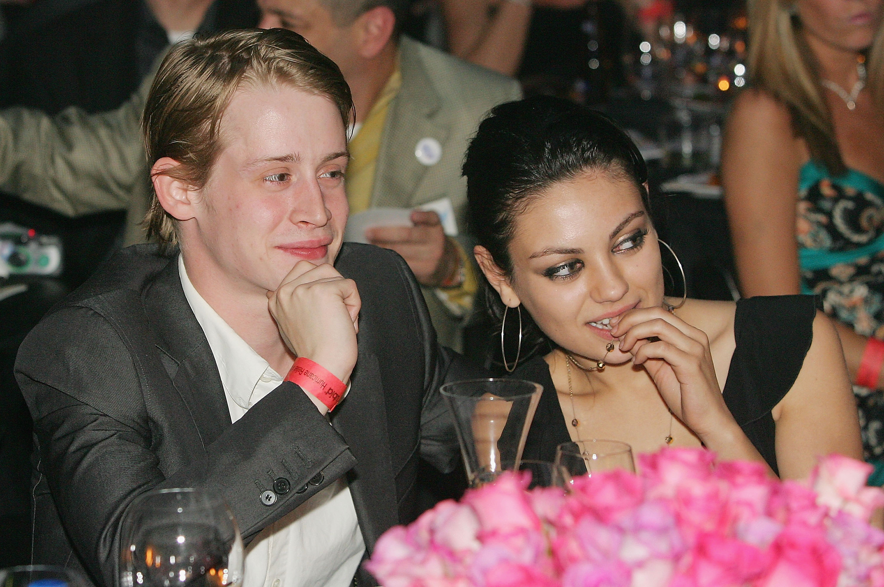 Actor Macaulay Culkin (L) and actress Mila Kunis attend the launch of the ‘uBid for Hurricane Relief’ charity auction and benefit at the Empire Ballroom October 15, 2005 in Las Vegas, Nevada.