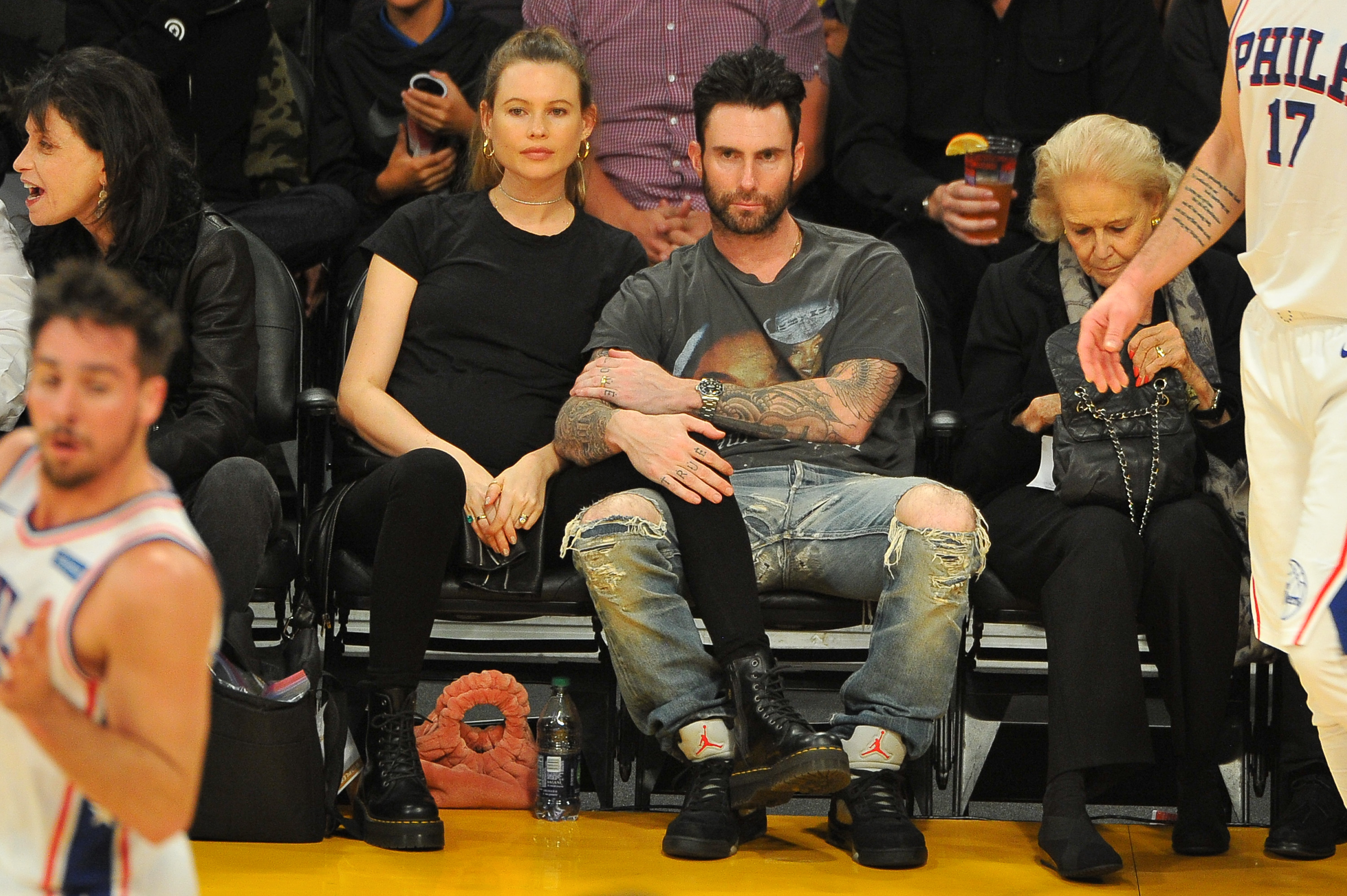 Behati Prinsloo and Adam Levine attend a basketball game between the Los Angeles Lakers and the Philadelphia 76ers at Staples Center on November 15, 2017 in Los Angeles