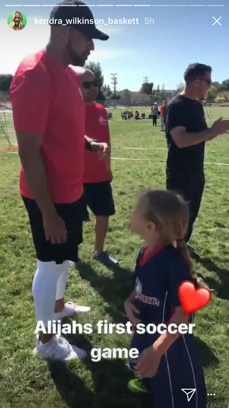 Kendra Wilkinson captures former husband Hank Baskett and 3-year-old daughter Alijah at Alijah’s first soccer game on April 8, 2018