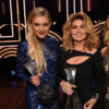 Honorees Kelsea Ballerini, Shania Twain and Carrie Underwood take photos backstage during CMT Artists of the Year 2016 on October 19, 2016 in Nashville