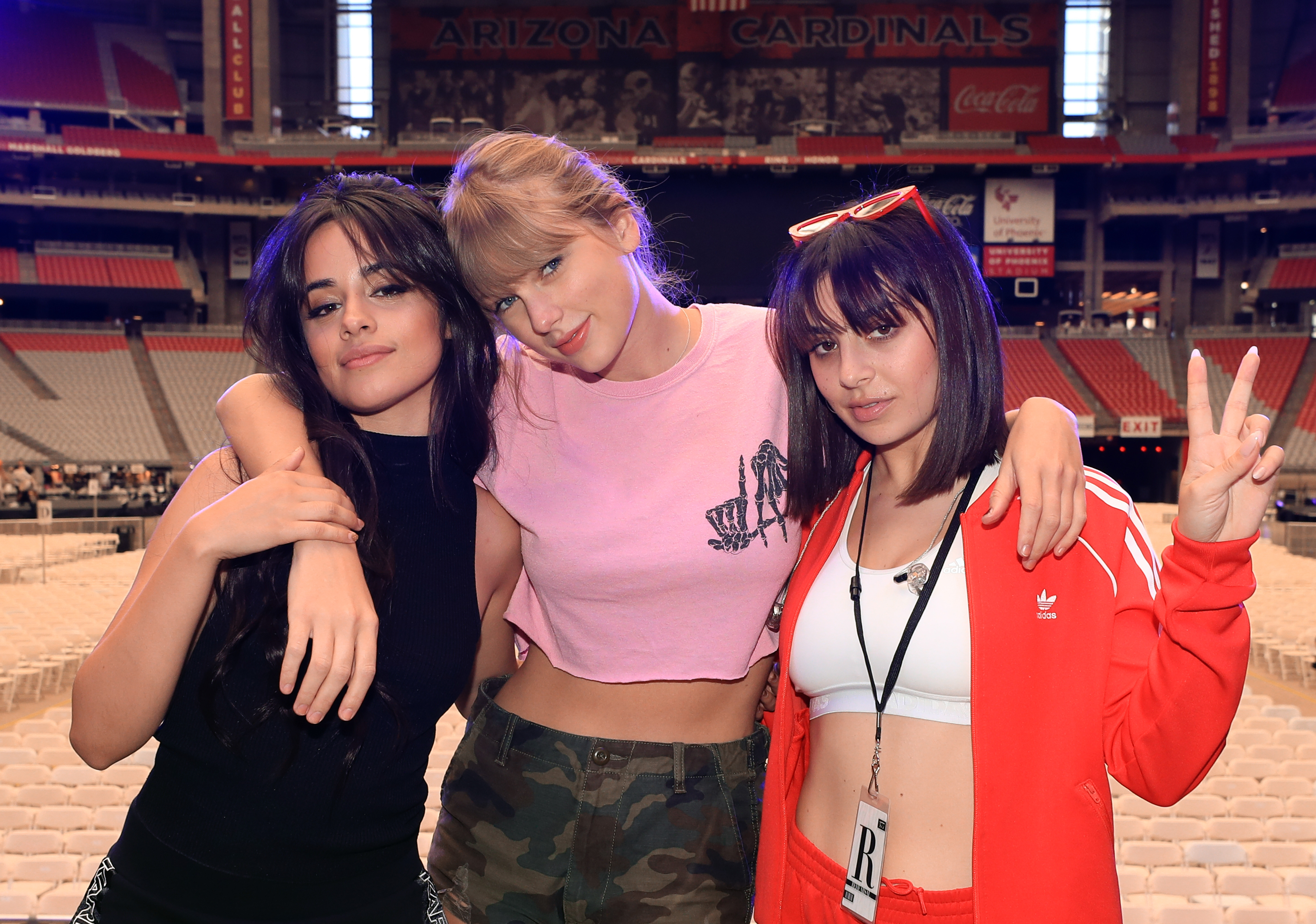 Camila Cabello, Taylor Swift, and Charli XCX pose onstage before opening night of Taylor Swift’s 2018 Reputation Stadium Tour at University of Phoenix Stadium on May 8, 2018 in Glendale, Ariz.